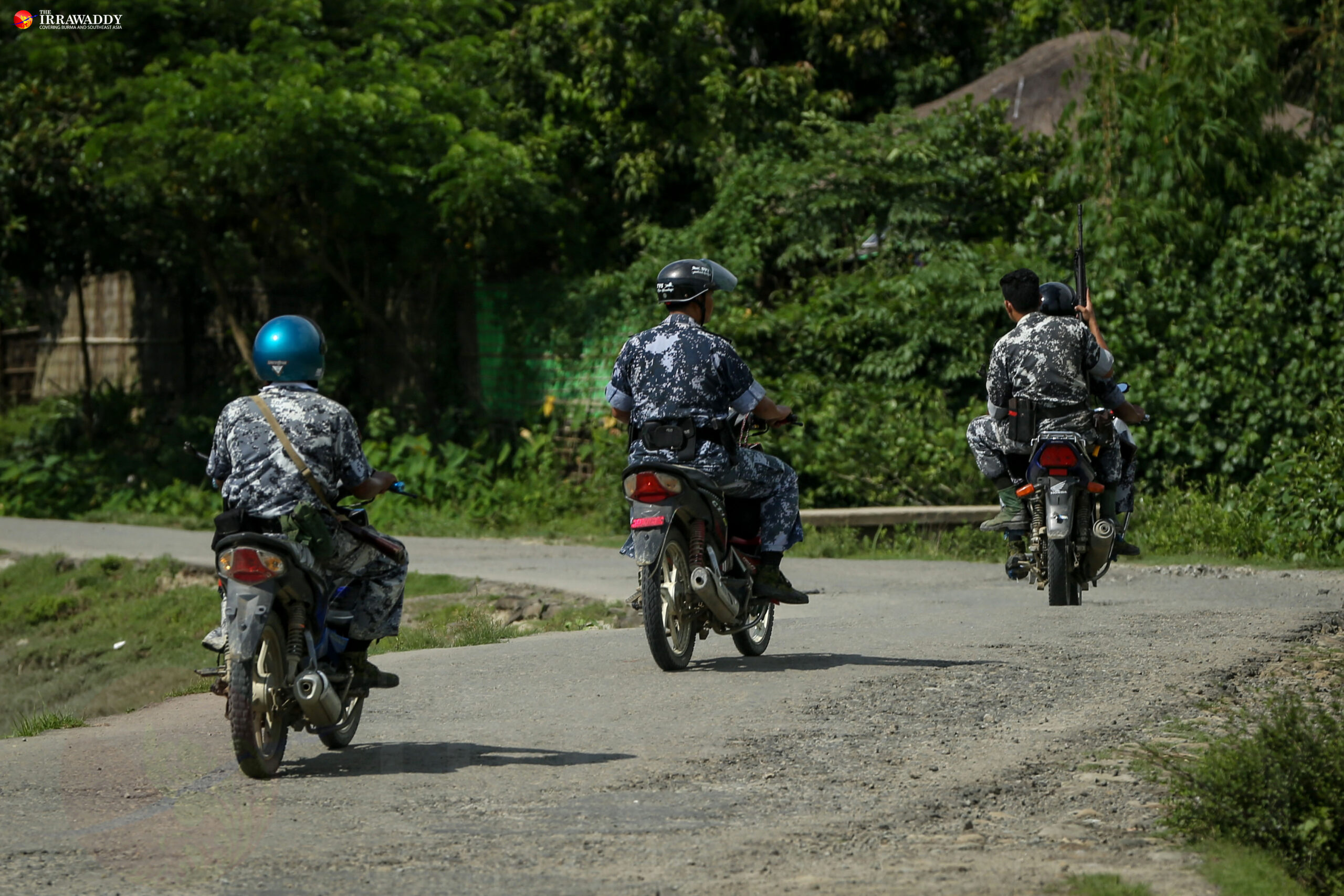 Border Guard Police patrol near Kyikanpyin village, Maungdaw Township. (Photo: Hein Htet / The Irrawaddy)