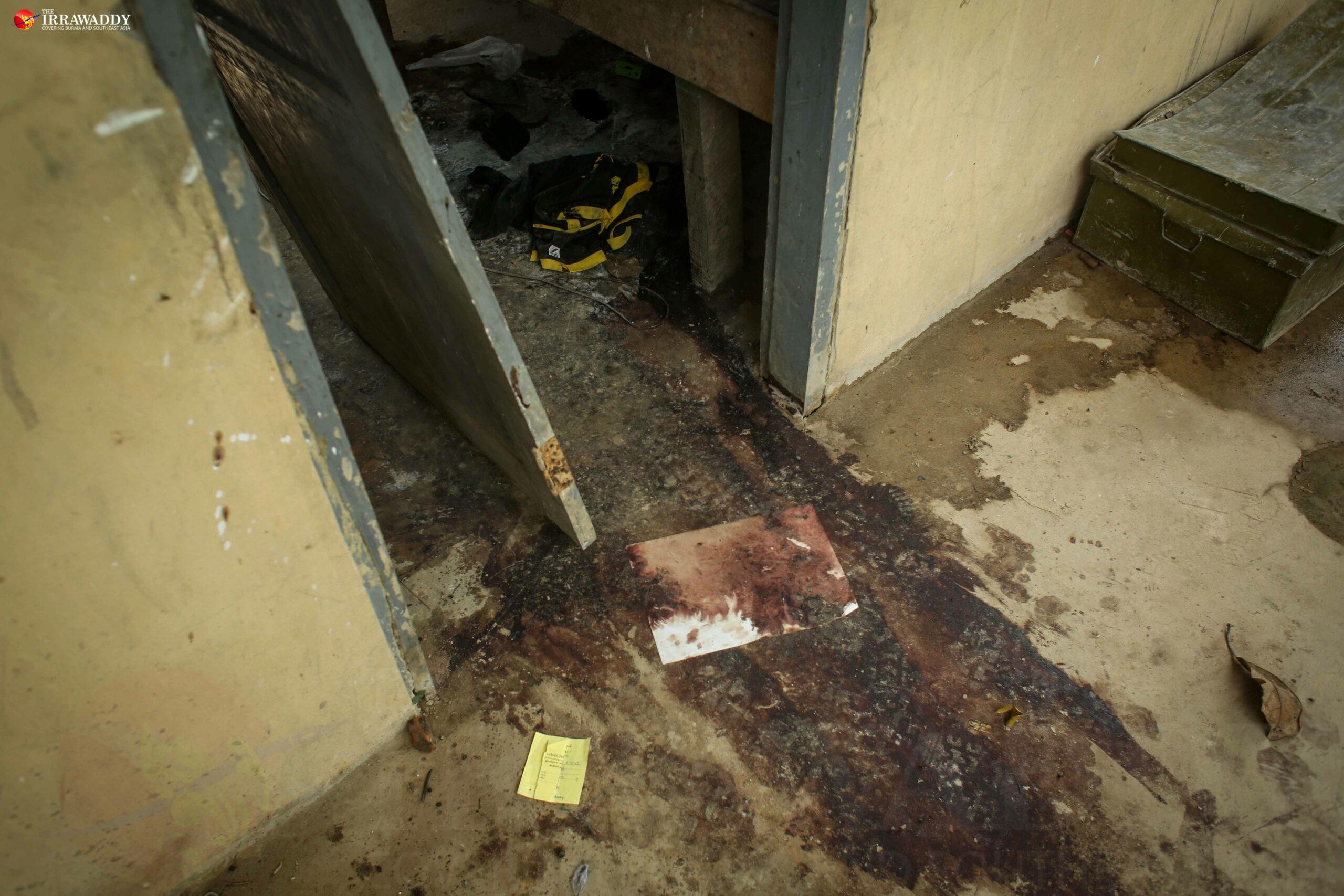 Dried blood and a smashed doorway seen on Monday at the Border Guard Police headquarters in Kyikanpyin village, Maungdaw Township, where five police officers were killed on Oct. 9. (Photo: Hein Htet / The Irrawaddy)