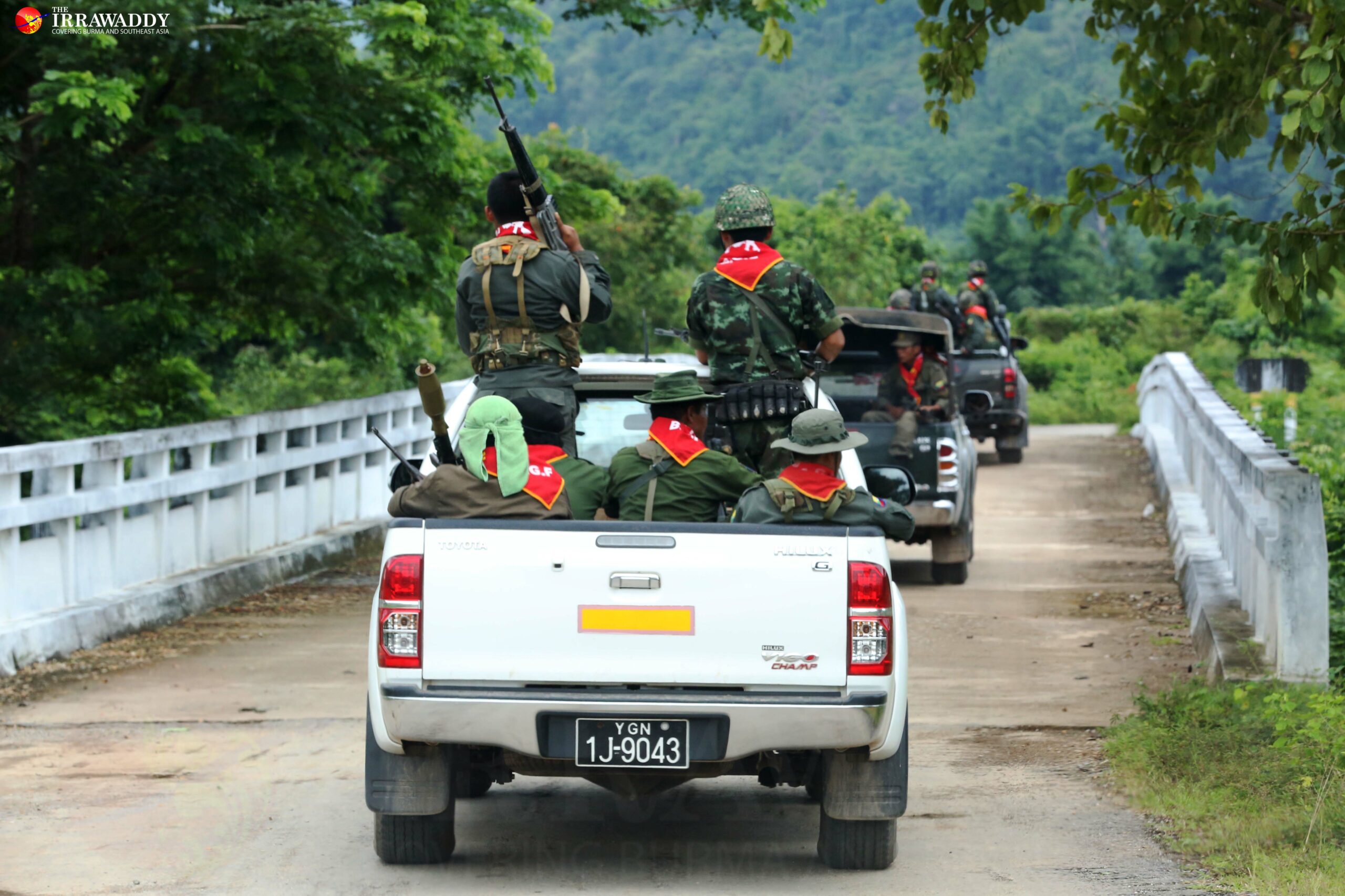 Soldiers from the Burma Army-backed militia the Border Guard Force travel along the highway between Mae Tha Waw and Myaing Gyi Ngu. 