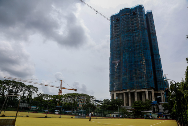 In picture, a high-rise condominium is under construction at Theinbyu Sporting Ground. (Photos: JPaing / The Irrawaddy)