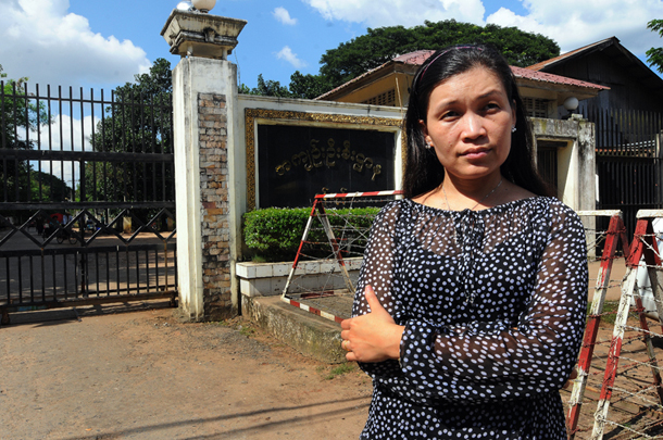 Peace activist May Sabe Phyu stands in front of Insein Prison, where her husband Patrick Khum Jaa Lee was detained while awaiting trial for defamation charges in 2015. He is now serving a six-month sentence. (Photo: Steve Tickner / The Irrawaddy)