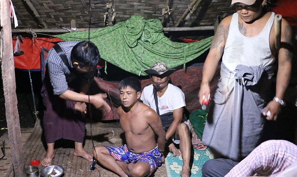 Police raid the house of Maung Maung Oo in Western Khone Thar Village near Kalay, Sagaing Division, on June 26. He was arrested earlier for drug possession, but no drugs were found in his home. (Photo: Swe Win / Myanmar Now)