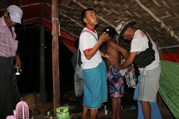 Police raid the house of Maung Maung Oo in Western Khone Thar Village near Kalay, Sagaing Region, on June 26. He was arrested earlier for drug possession, but no drugs were found in his home. (Photo: Swe Win / Myanmar Now)