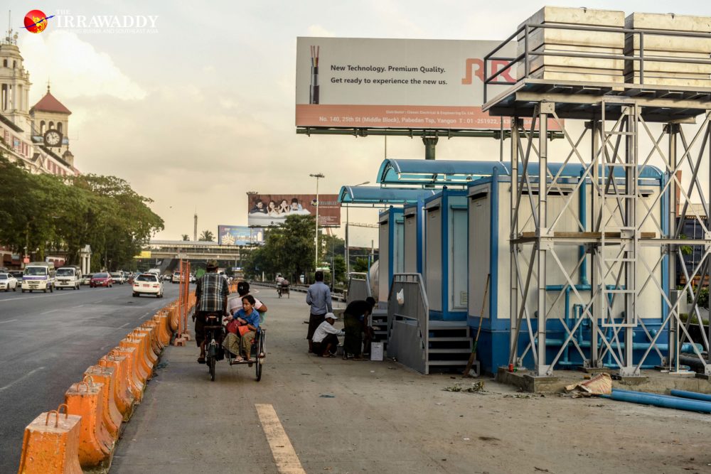  Workers prepare public toilets at one of the designated vendor locations on Strand Road. (Photo: Pyay Kyaw / The Irrawaddy) 